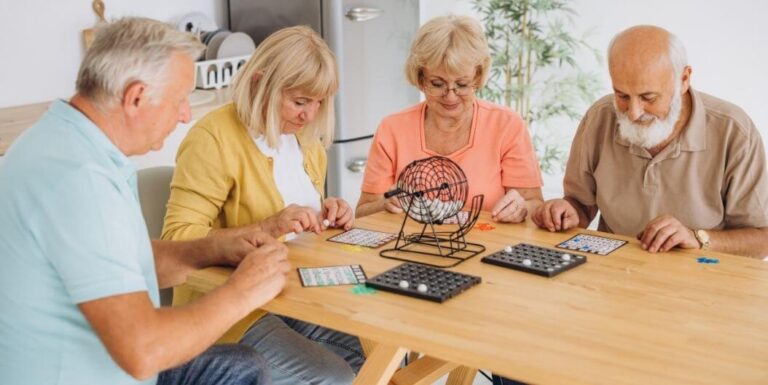 Elderly Residents Playing Bingo Game Together at Assisted Living Facility
